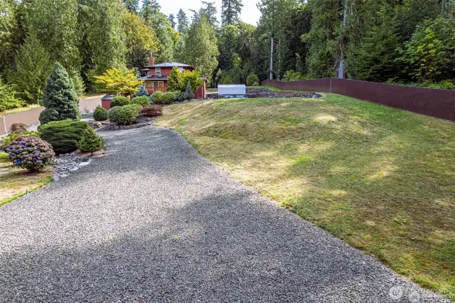 This shows the vacant lot to the south of the house. You are in the SW corner looking east.