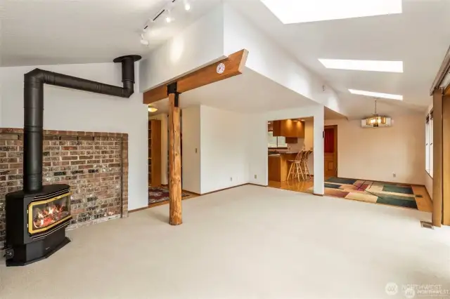From the NW corner looking to the dining room and the kitchen area without the virtual staging.