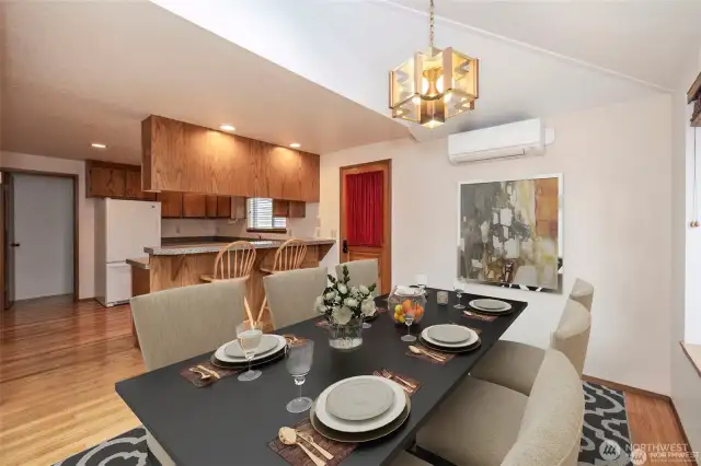 The dining room opens into the kitchen and living room. Virtual staging