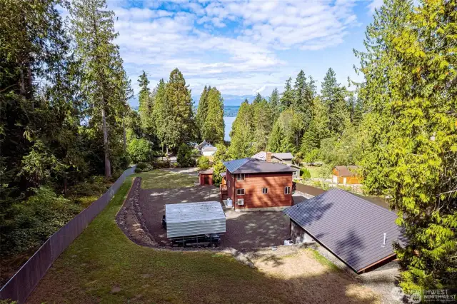 Photo taken from the upper back yard area looking west across the Hood Canal to the Olympics Mountains