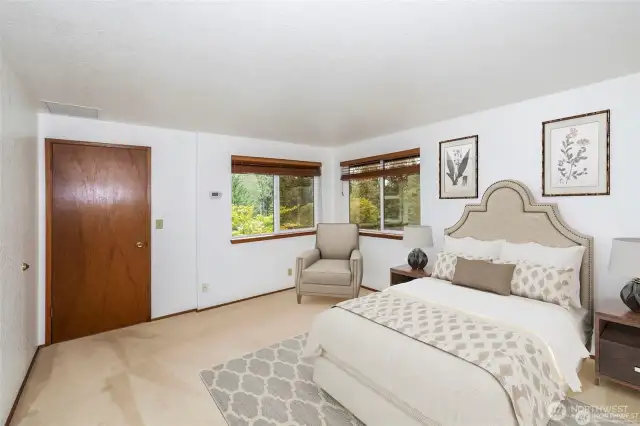 This is currently the primary bedroom has views out to the west and north.  Virtual staging