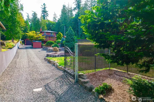 Gated entry and entirely fenced around both properties.