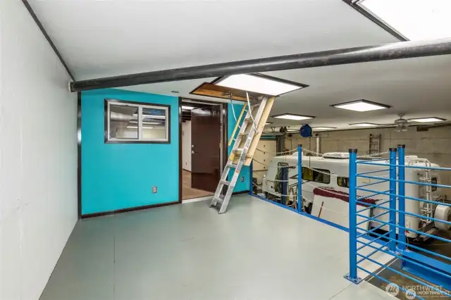 Upper area that goes into the office space. Note one of the two pulldown ladder going into the attic storage area.