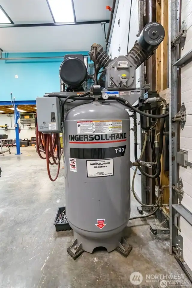 This commercial grade compressor with all the connected pull-down hookup lines stays.
