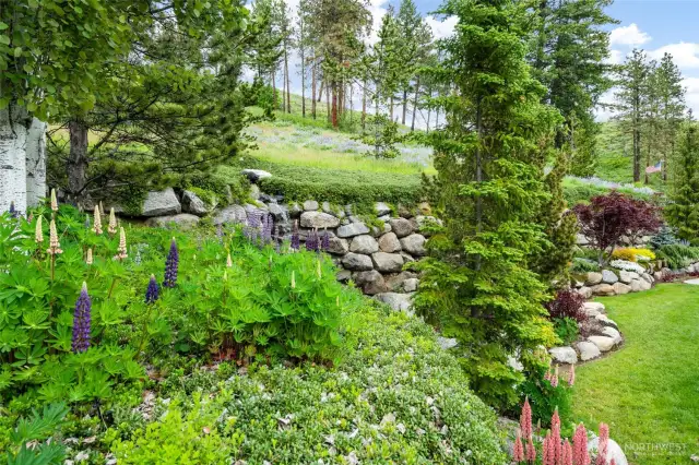 Waterfall and rock wall in back of home.