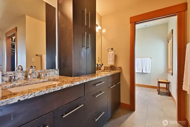 Primary bathroom. Double sinks and plenty of storage.