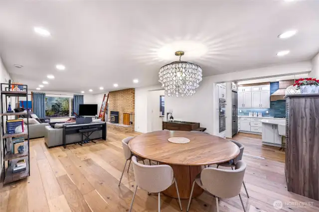 Statement light fixture anchors this bright dining room, ideal for meals or entertaining.