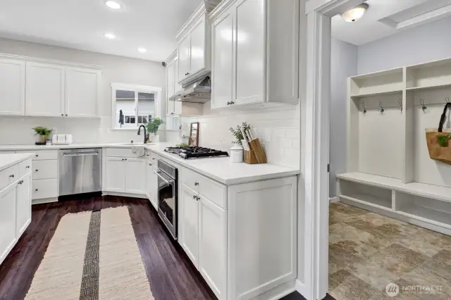 There's a large mudroom that provides access from the garage to the kitchen and also has a door to the backyard