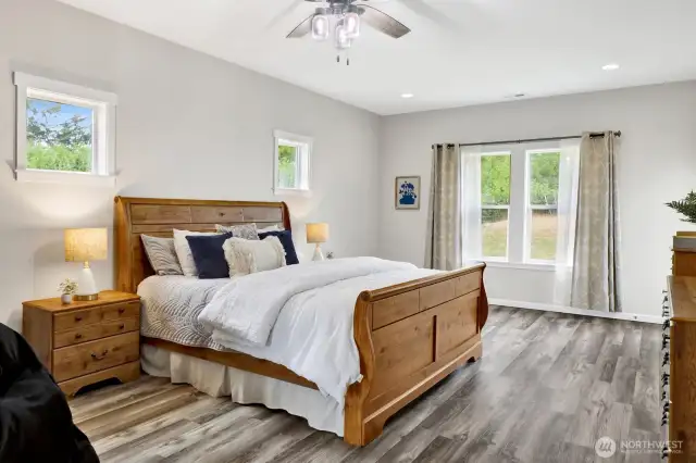 The primary suite is on the main level and it's spacious and bright