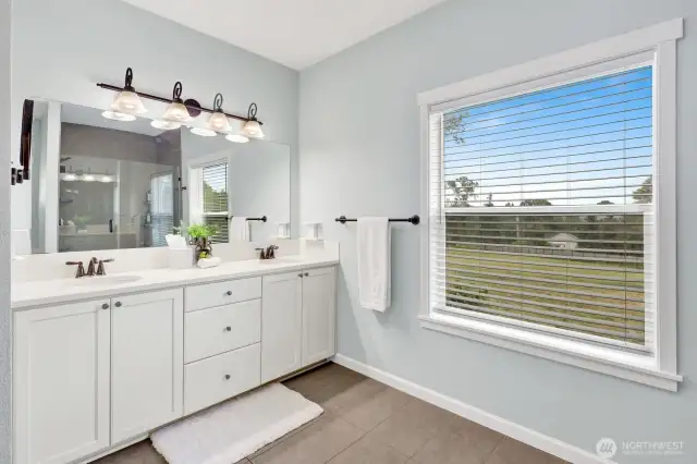 The primary bathroom is large and bright