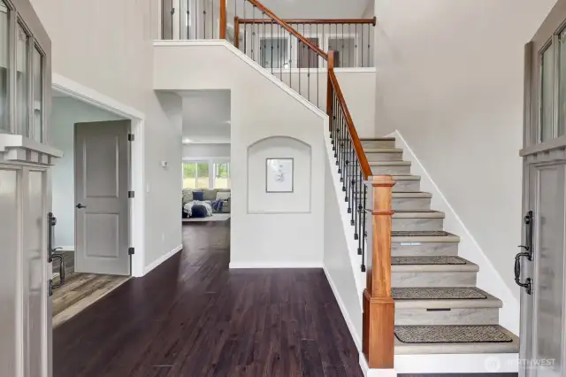 Don't miss the engineered hardwood floors, fresh paint, and the grand staircase