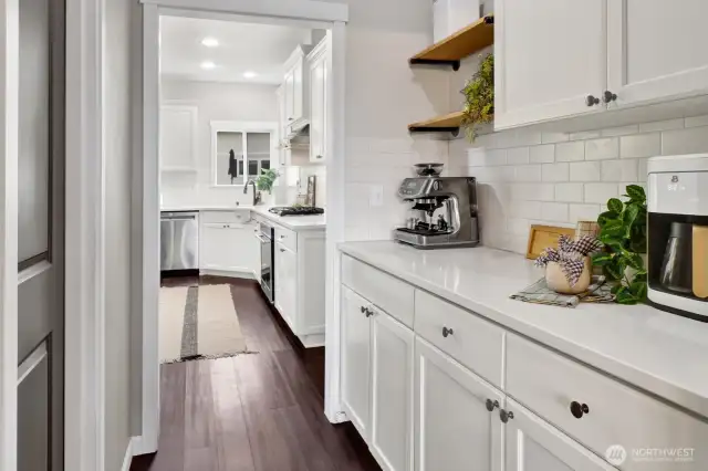 The butler's pantry is open to the kitchen and is a great spot for a coffee bar. It's adjacent to a large walk-in pantry