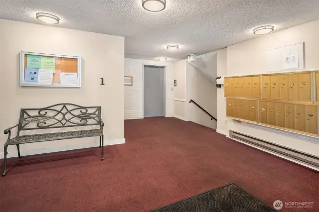 Side Entrance to building with mailboxes and elevator
