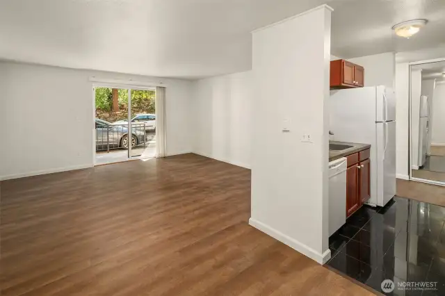 From the dining area a spacious living room with Luxury Vinyl Plank Flooring.