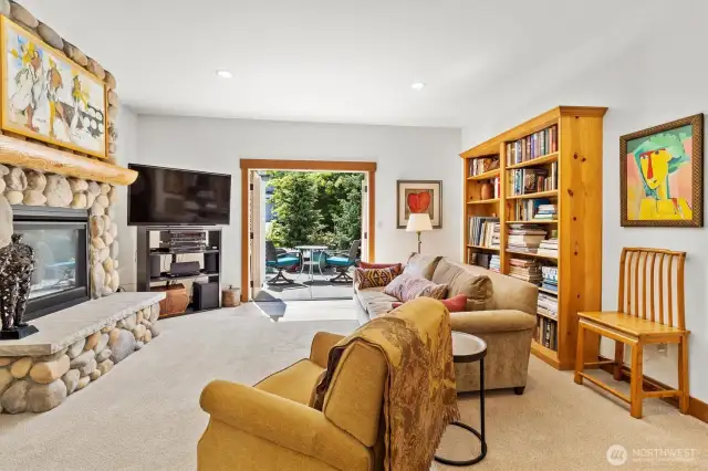 Cozy Living Room with Fireplace and Patio Access