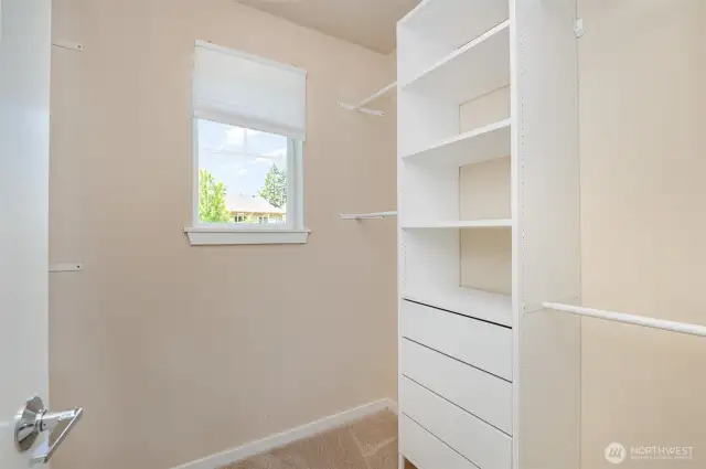 Walk-in closet with custom cabinetry
