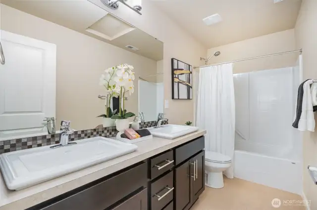 Hall bathroom with double sink