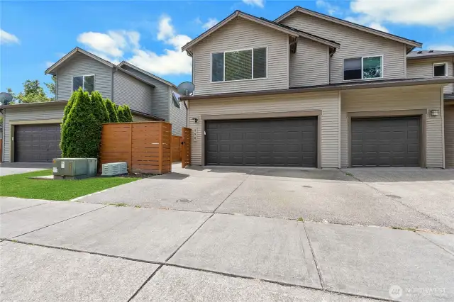 Left side unit w/ double car garage (even has A/C in the garage!). Shared driveway to other unit.  Fully fenced.