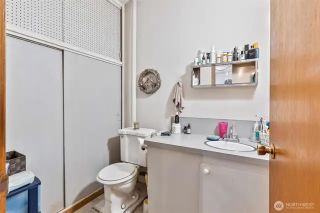 3rd bedroom/studio storage closet, toilet ,and sink.