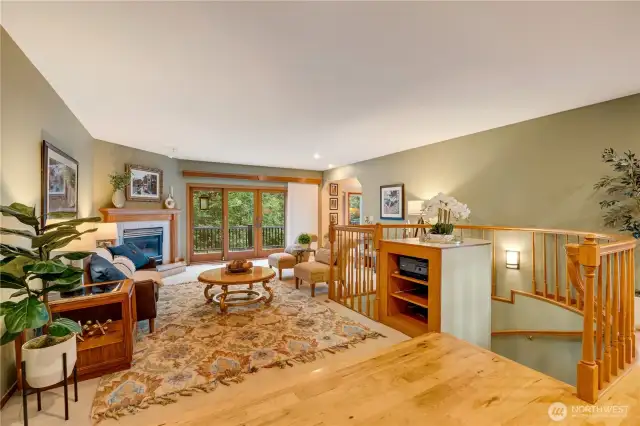 Spacious living room with fireplace and large windows, perfect for cozy nights or entertaining in Maple Valley.