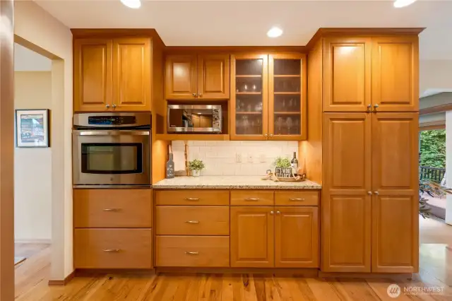 Wall-to-wall storage and pantry space for all your culinary needs—function meets style in this Maple Valley kitchen.