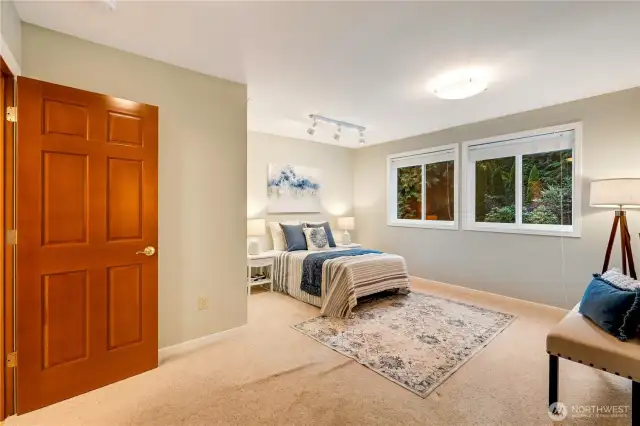 Spacious bonus bedroom with serene views—flexibility to meet any lifestyle.