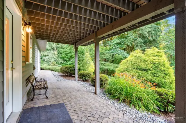 Patio area overlooks lush greenery—ideal for year-round outdoor enjoyment in Maple Valley’s temperate climate.