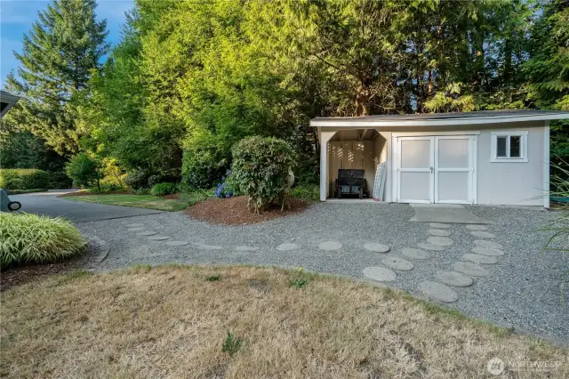 Detached structure—ideal for additional storage, lawn equipment, or hobby shop in this Maple Valley estate property.