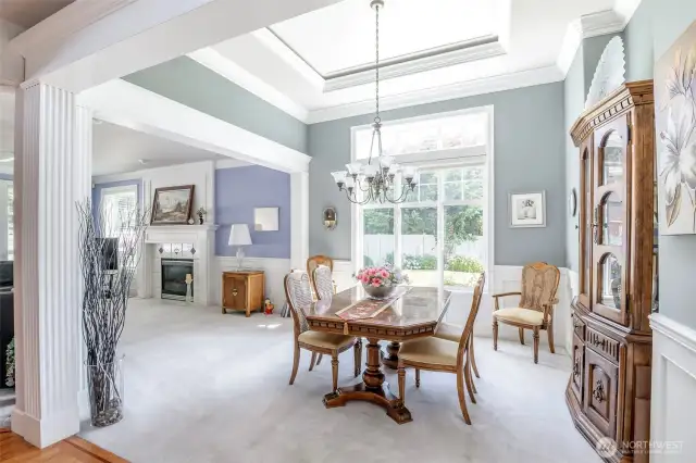 Dining room with cased opening and crown moulding