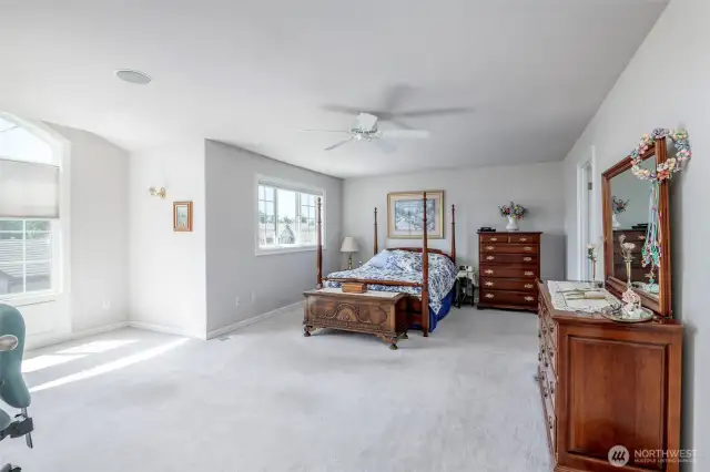 Spacious primary suite with partial view of Mt Rainier.