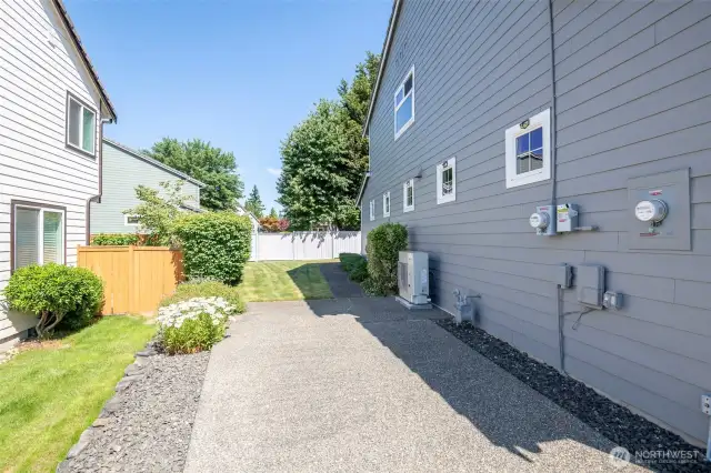 South side of home has concrete pad for parking additional cars.