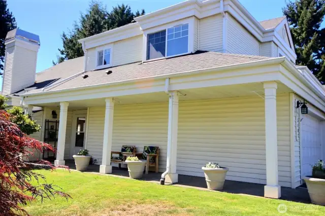 Covered walkway is perfect for hanging or potted plants.