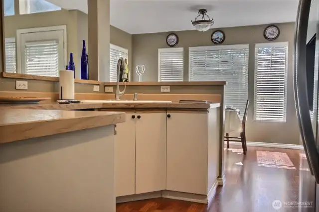 Kitchen conters upgraded with laminate tops and shelf storage.