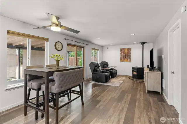 View from kitchen looking at second living room space and slider to your amazing backyard.