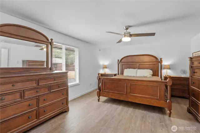 This is the primary suite with walk-in closet and large primary bathroom.