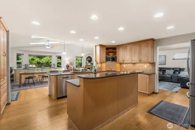 The kitchen has great flow. Check out how easy it is for the cook to not be disturbed, yet everyone can walk through, get a snack or beverage or hang out at the breakfast bar.