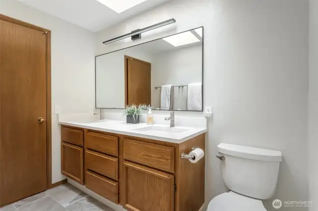 Quartz countertops in the 5 piece Primary Bathroom