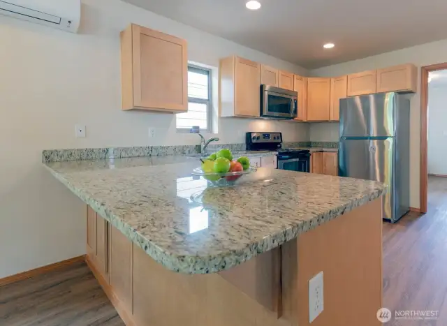 Kitchen with eating bar counter.