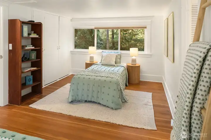 Right side of the large upstairs bedroom with views of the parklike property