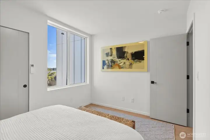 Wake up to sunlit mornings in this tranquil retreat, complete with large windows and contemporary design accents.