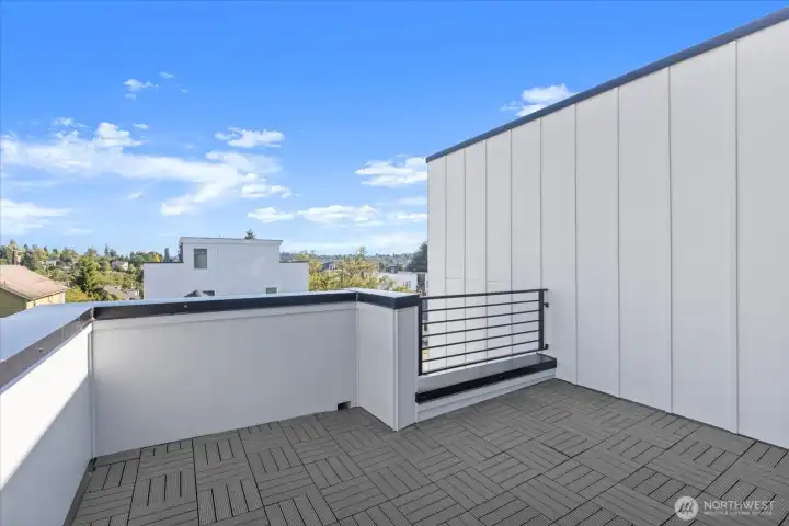 Soak in neighborhood views and blue skies from this private rooftop perch, ideal for relaxing or entertaining.