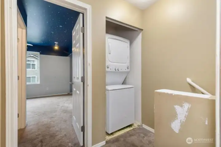 The laundry is at the top of the stairs, conveniently located by the bedrooms.