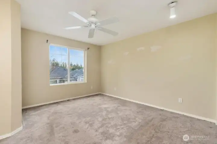 Another view of the primary bedroom.