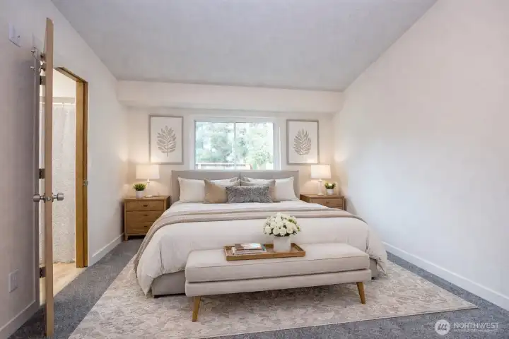 Beautifully updated upper-level primary suite with new carpet and a light-filled, updated window.