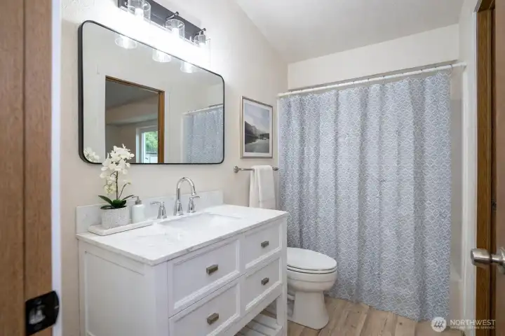 Upper-level continental bathroom featuring recent updates and stylish finishes.