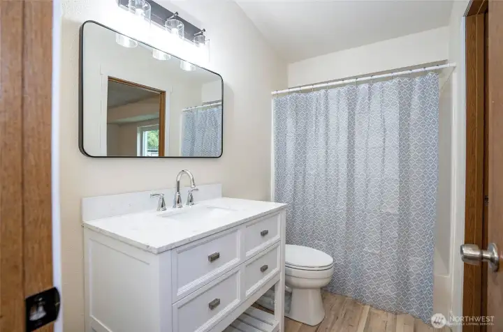 Upper-level continental bathroom featuring recent updates and stylish finishes.