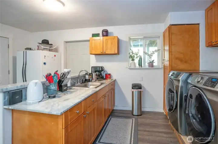 Spacious kitchen in the mother-in-law suite with beautiful cabinetry and plenty of counter space.