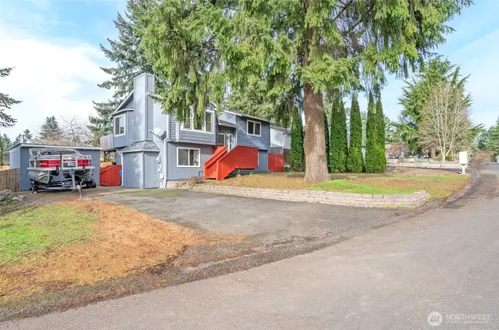 Showcasing the expansive corner lot with plenty of space and curb appeal.