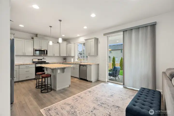 The eating area is also spacious with a big slider out to the patio.