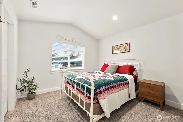 Bedroom #2 with vaulted ceilings and room for big bedroom furniture.